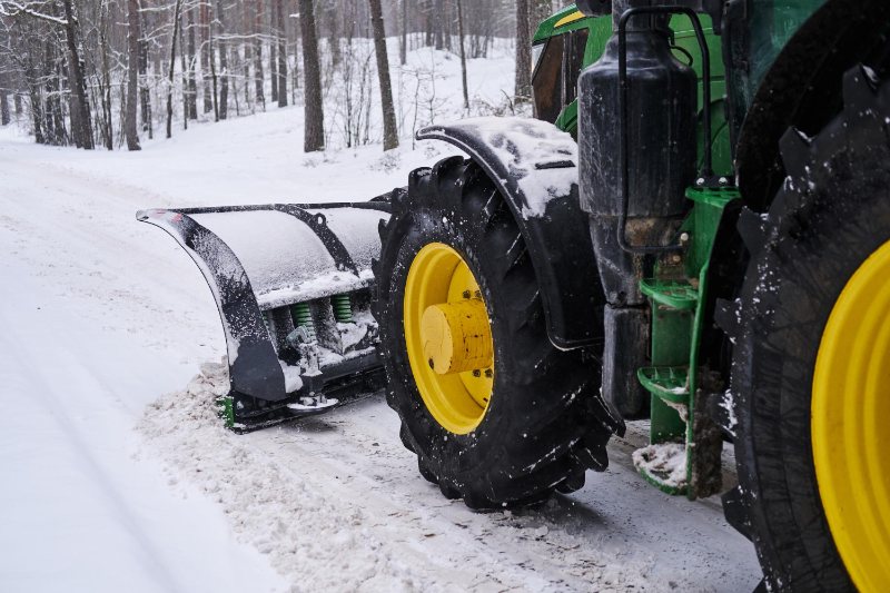 snow tractor removing snow